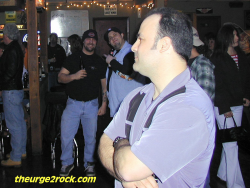 Dave pretends he doesn't notice the two guys checkin him out...